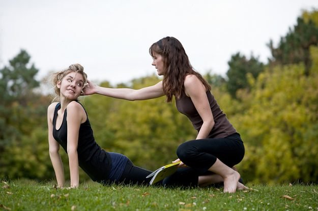 Tow woman practicing yoga