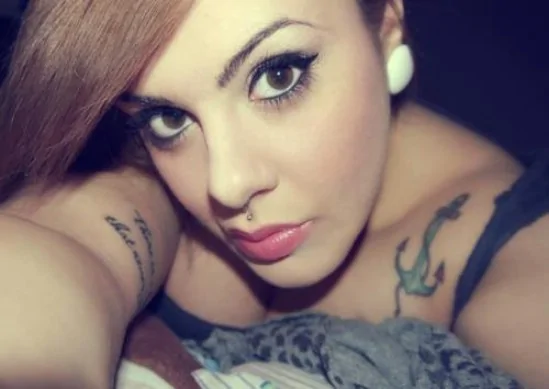Young woman with medusa piercing