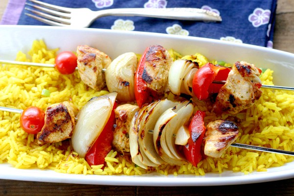 Finished smoked paprika and thai chili chicken kebobs with turmeric rice