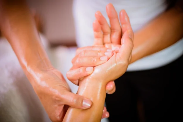 Massaging hand with oil