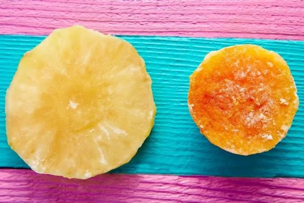 Image of a half cut papaya and pineapple prepared for a diy face mask without honey