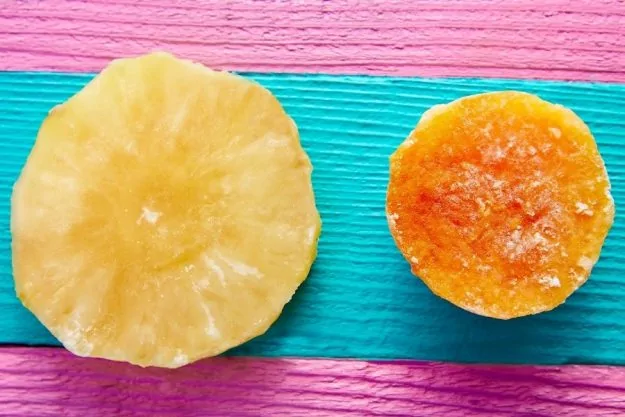 Image of a half cut papaya and pineapple prepared for a DIY face mask without honey