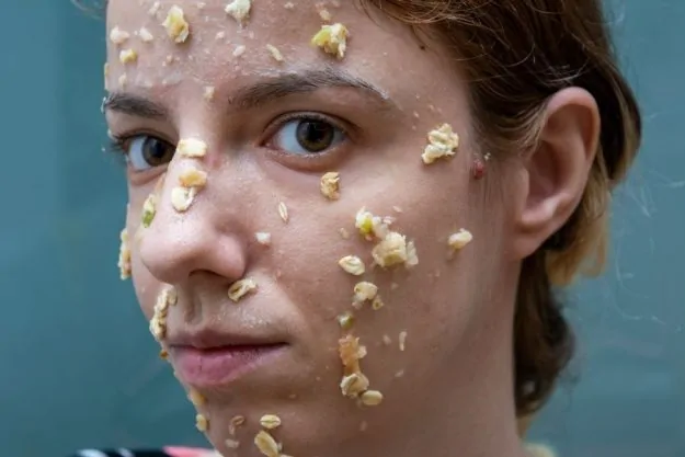 Image of a woman wearing diy oatmeal face mask without honey