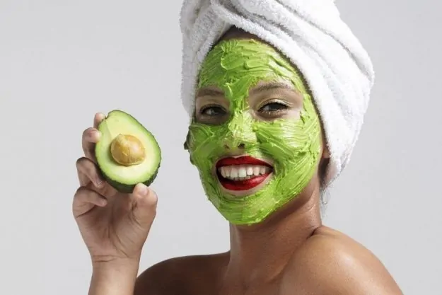 Image of a woman with homemade avocado face mask with no honey