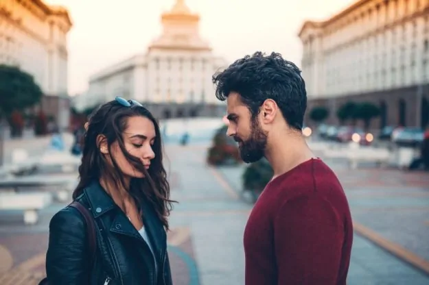ex guy looking in the eye and pretending to be over her