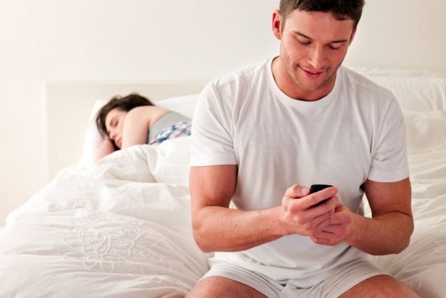 guy changing password on his phone