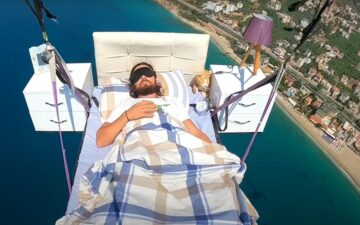 Paraglider Hasan Kaval takes a nap in bed mid air