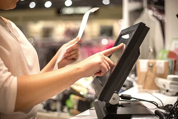 Cashier with receipt