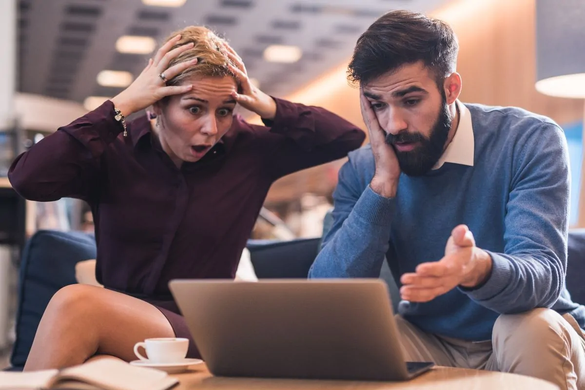 Employees looking at their laptop