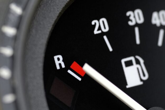 Low gas indicator on the car dashboard