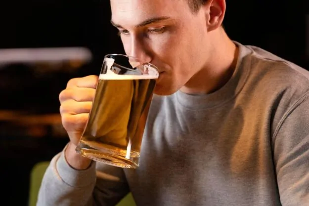 Man drinking in a pub