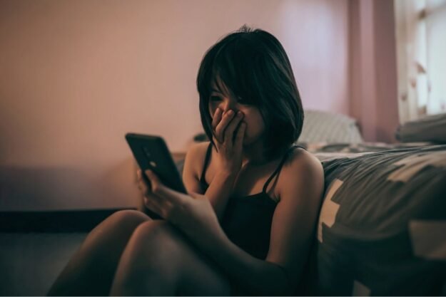 crying woman on the phone